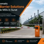 Automatic boom barrier installed at the entrance of a textile mill in Surat for secure vehicle access control, RFID integration, and industrial traffic management by FIA.